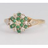 A 9ct yellow gold emerald and diamond cluster ring, size P, 2.1 grams