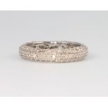 A 9ct white gold diamond set band, size I, 1.9 grams