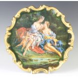 A Continental wall plaque decorated with classical figures enclosed in a gilt rococo border 30cm