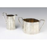 A Victorian engraved silver cream jug and sugar bowl, London 1867, 538 grams