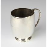 A silver baluster mug of plain form with simple C scroll handle, Birmingham 1947, 368 gram