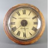 A postman's alarm clock with 21cm dial marked J Elliott and Company of Cardiff complete with 2