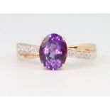 A 9ct yellow gold amethyst and diamond ring size P, 2.5 grams