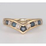 A 9ct yellow gold sapphire and diamond wishbone ring, size L, 2.1 grams