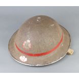 A World War Two National Fire Service leading fireman's steel helmet marked 31, the interior