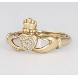 A 9ct yellow gold diamond set Claddagh ring, size O, 1.9 grams