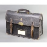 A 1960's Elizabeth II Civil Service black leather briefcase with Royal Cypher, interior marked B.