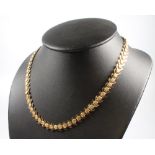 A 9ct yellow gold fancy link necklace 42cm, 25.7 grams