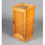 A Victorian pine pot cupboard with 3/4 gallery, the interior fitted a shelf enclosed by a panelled