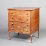 A Georgian mahogany commode in the form of a chest with hinged lid raised on turned supports 75cm