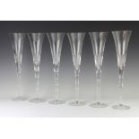 A set of 6 Renwick and Clarke champagne flutes 34cm h