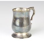 A Georgian style silver baluster mug with S scroll handle, London 1979, engraved monogram, 239