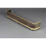 A 19th Century polished steel and brass fender raised on bun feet 21cm x 47cm x 23cm