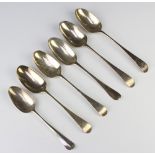 Six Georgian silver table spoons, rubbed marks, 352 grams