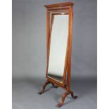 An Edwardian rectangular bevelled plate cheval mirror contained in an inlaid mahogany frame with