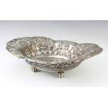 A Continental 800 standard oval pierced and repousse dish decorated with stylised flowers, 33.5