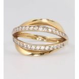 A 14ct yellow gold diamond crossover ring size M 1/2, 2.5 grams