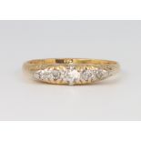 An 18ct yellow gold 5 stone diamond ring, size M, 2.9 grams