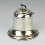 A silver inkwell in the form of a bell Birmingham 1912, 9.5cm The lid slightly dented and the