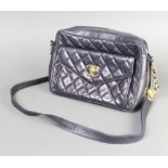 Chanel, a lady's vintage Chanel navy blue quilted leather handbag with Chanel logo twist lock to the