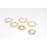 Three pairs of 9ct yellow gold half hoop earrings 6.3 grams