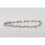 An 18ct yellow gold 12 stone diamond bracelet 5.2 grams, 16.5cm