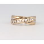 A 9ct yellow gold channel set diamond ring size I 1/2, 2.5 grams