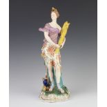 A 19th Century Derby figure of the season Summer with a lady holding a sheaf of corn with a vase and