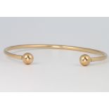 A 9ct yellow gold torque bangle 3.9 grams