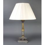 A Regency style gilt metal table lamp raised on 4 paw supports with triform base 40cm x 19cm