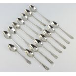 A set of 15 silver teaspoons with golfing handles, Sheffield 1933, 204 grams