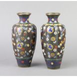 A pair of 19th Century Japanese black ground and floral patterned cloisonne club shaped vases with