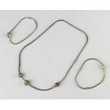 A silver Pandora necklace and 2 bracelets, 64 grams