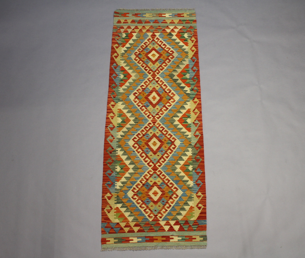 A yellow, turquoise and tan ground Chobi Kilim runner 195cm x 70cm