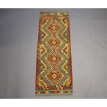 A yellow, turquoise and tan ground Chobi Kilim runner 195cm x 70cm