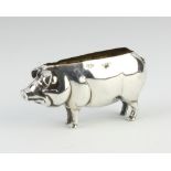 An Edwardian novelty silver pin cushion in the form of a pig Birmingham 1906, 6.5cm The pin