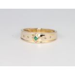 A 9ct yellow gold emerald and diamond set ring, size M, 2 grams