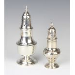 A Queen Anne style silver sugar shaker Birmingham 1972, a smaller ditto indistinct marks 197 grams