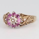 A 9ct yellow gold ruby and diamond cluster ring size T, 4.5 grams