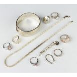 A silver bangle and minor silver jewellery, 100 grams