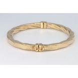 A 9ct yellow gold oval bangle 8.5 grams