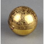 A novelty gilt compact in the form of a globe 4.5cm