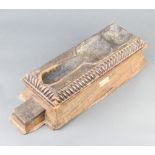 A rectangular "gavel" stand of wedge form with brick decoration, marked Recovered from Tura Caves