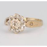 A 9ct yellow gold diamond cluster ring, size J, 1.8 grams