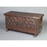 A 17th/18th Century Continental carved oak coffer with iron lock 60cm h x 121cm w x 43cm d A section