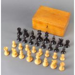 A turned wooden Staunton chess set The white rook is loose and requires gluing