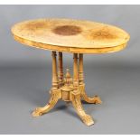 A Victorian inlaid figured walnut centre table raised on 4 turned columns with outswept supports