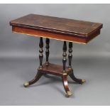 A Victorian Continental rosewood and inlaid brass card table raised on 4 turned columns with