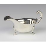 A silver sauce boat with S scroll handle on hoof feet Sheffield 1933, 166 grams