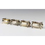 A set of 4 Edwardian silver table salts of rounded rectangular form on pad feet, Birmingham 1902,